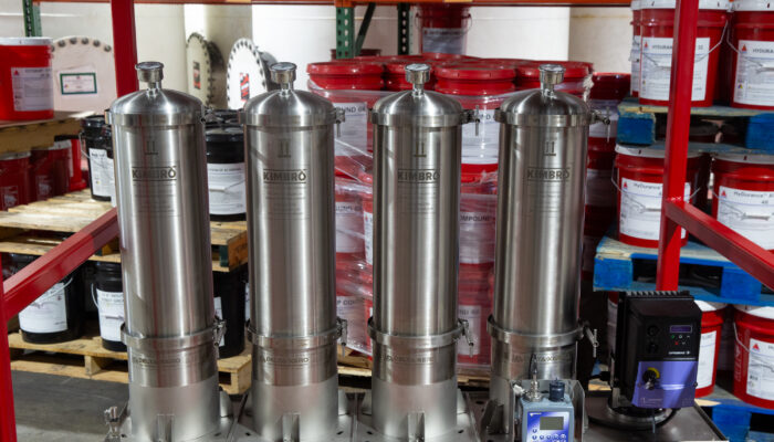 Row of stainless steel filtration units in the Kimbro warehouse