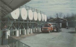 Vintage photo of a bulk fuel storage plant with a tanker truck
