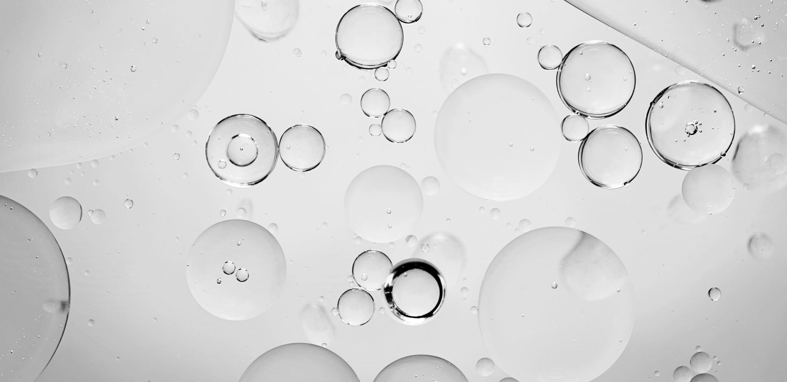 Close-up of air bubbles and contaminants suspended in oil