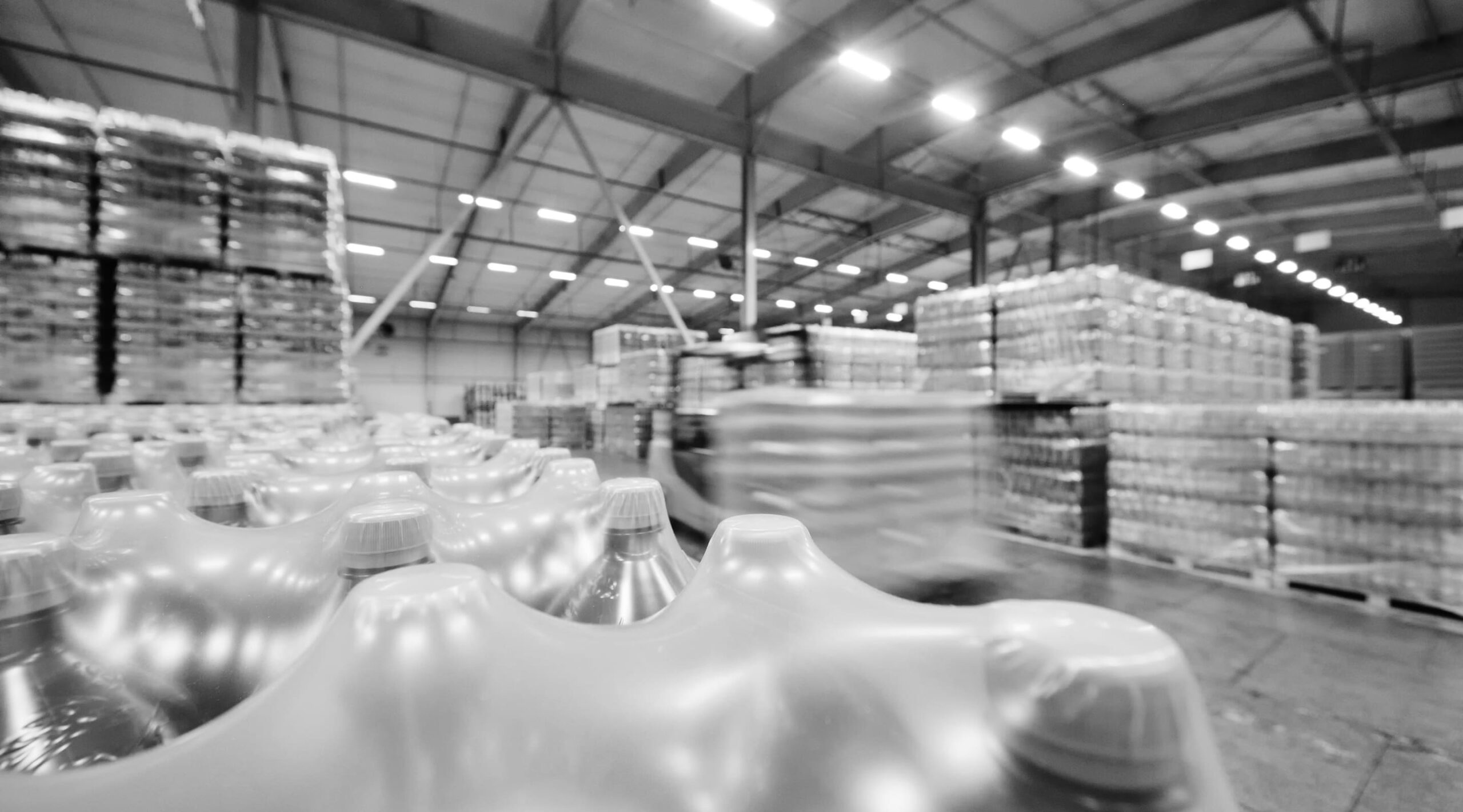 Pallets of bottled water in a distribution warehouse