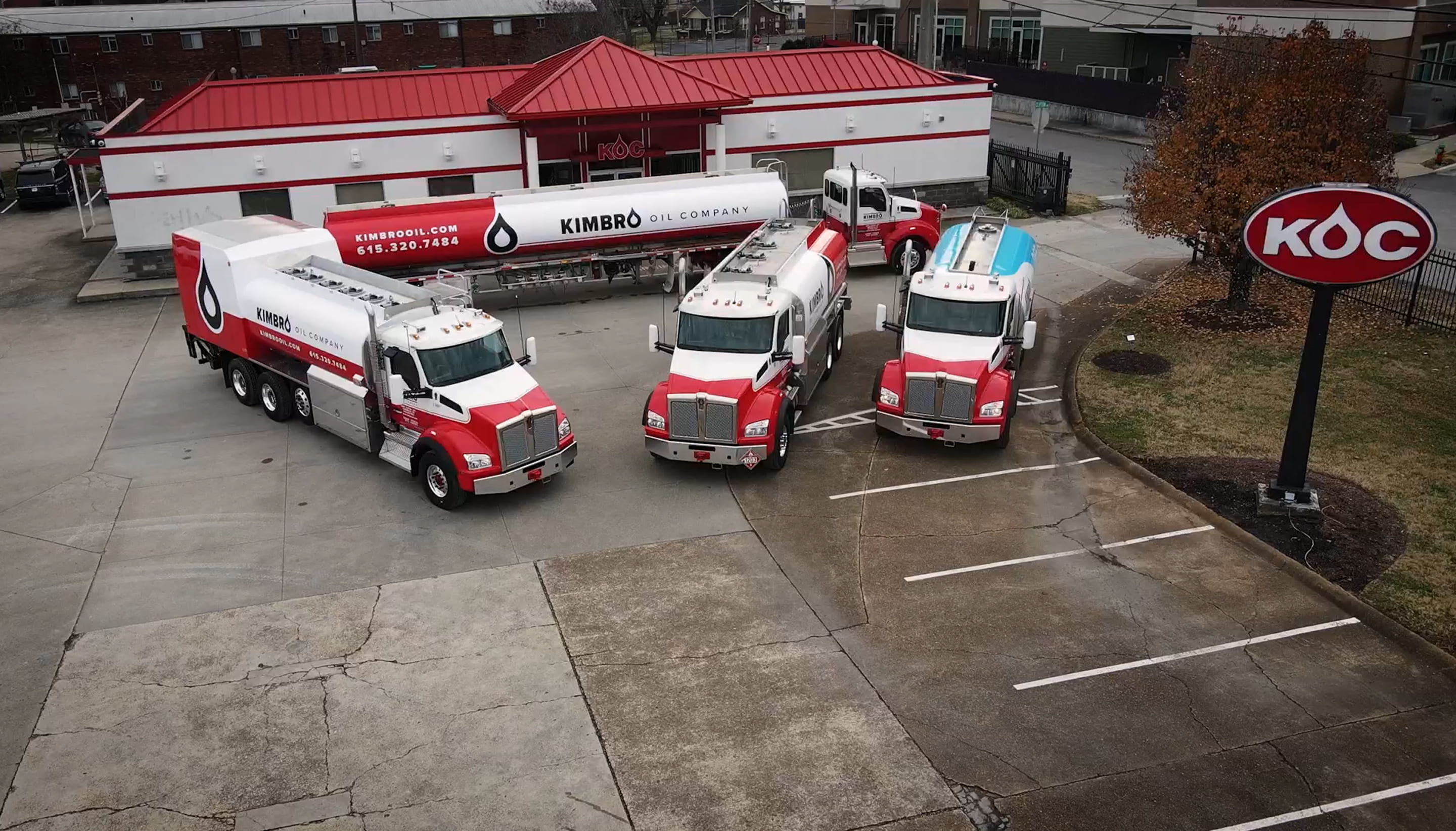 Aerial view of Kimbro fuel delivery trucks outside the Kimbro Oil Company facility