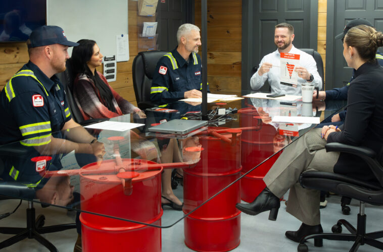 Kimbro team members meeting around a conference table