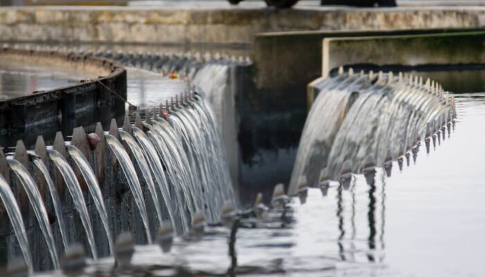 Water flowing over weirs at a water treatment plant