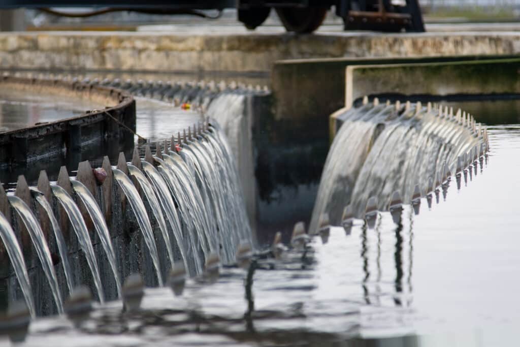Water flowing over weirs at a water treatment plant