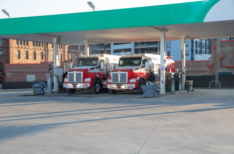 Kimbro fuel trucks under a fueling station canopy