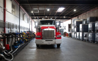 Red semi-truck parked inside the Kimbro warehouse