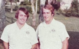 Vintage photo of two Kimbro employees in uniform shirts