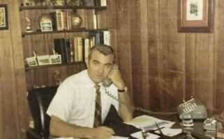 Vintage photo of a Kimbro executive on the phone at his desk